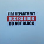 do not block access door sign